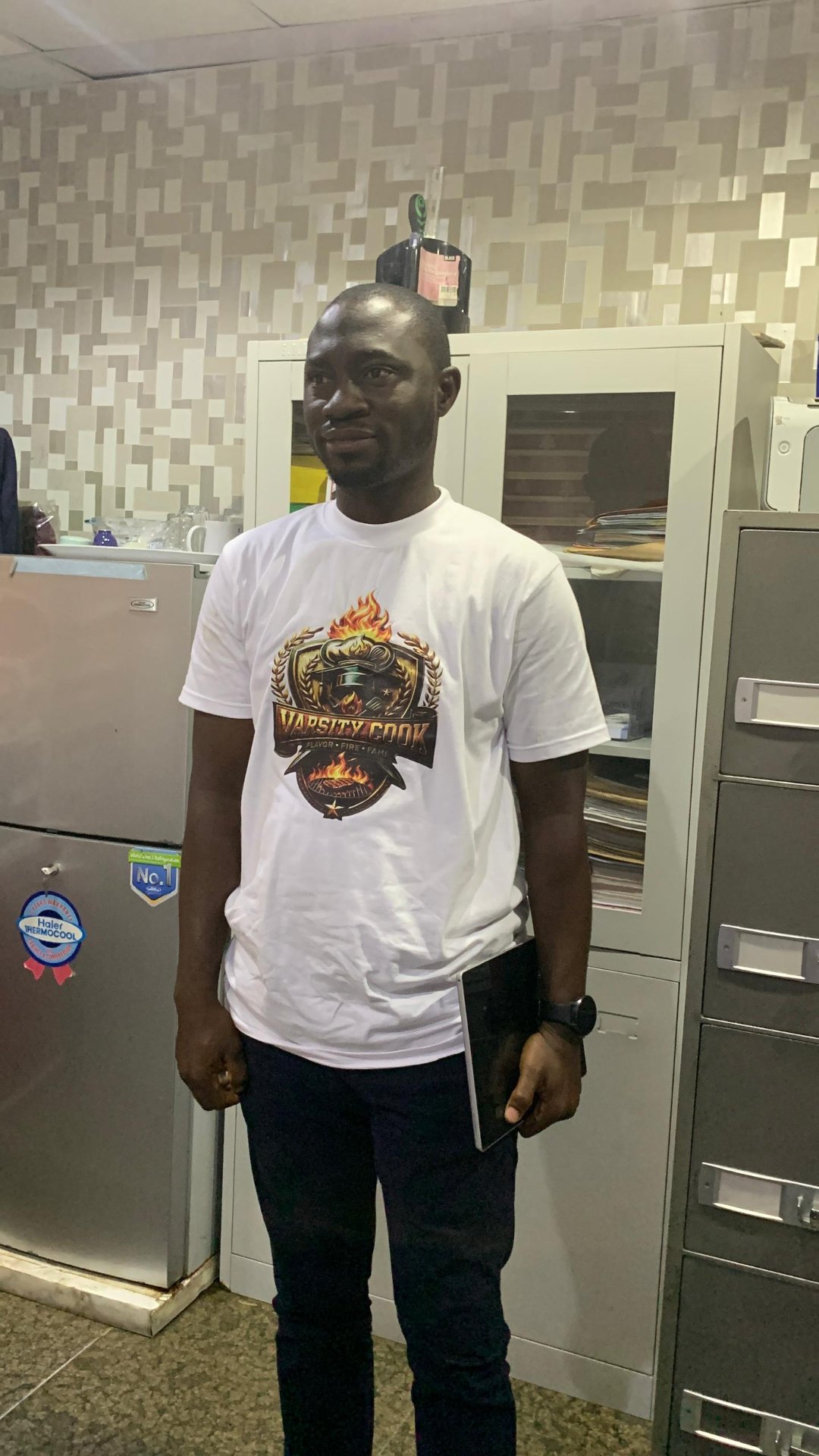 Varsity Cook team member in official branded shirt