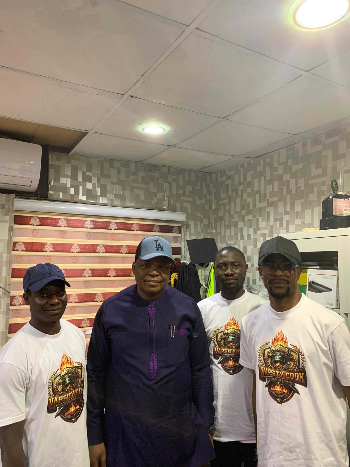 Varsity Cook team meeting with a university official